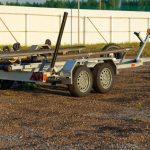 A boat trailer sitting in lot