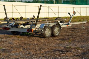 A boat trailer sitting in lot